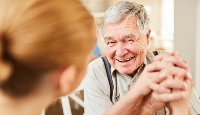 Man smiling with woman